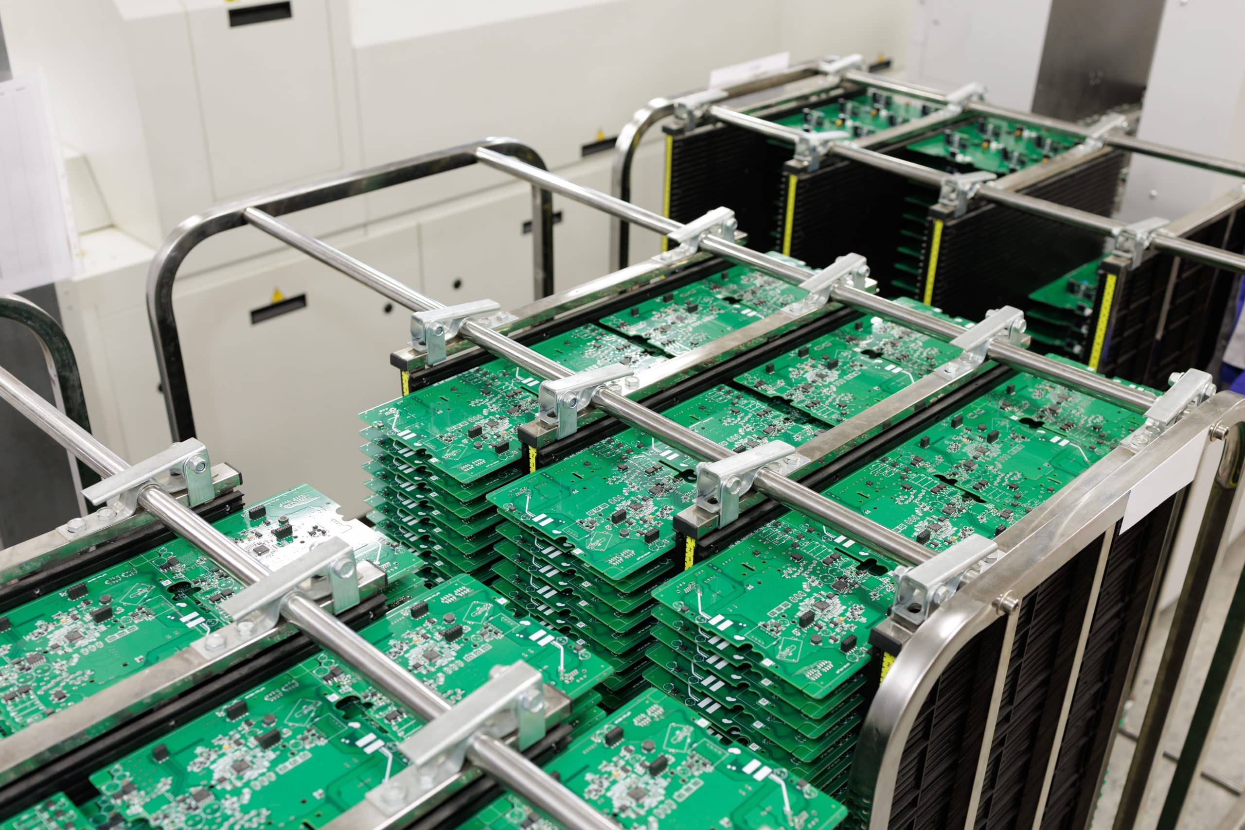 PCB panel Stacks of PCB panels in antistatic rack on SMT assembly line